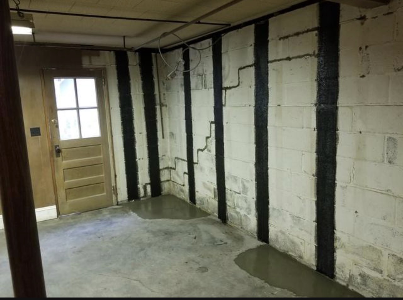 Concrete wall with black Carbon Fiber Wall Reinforcement